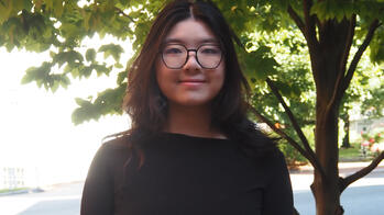 photo of a student outside by a tree