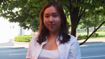 photo of a student outside by a tree