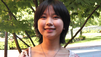 photo of a student outside by a tree