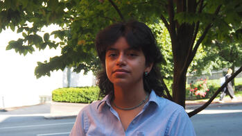 photo of a student outside by a tree
