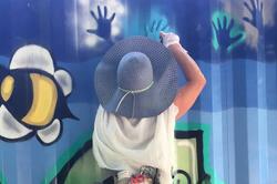 A woman painting a mural