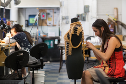 Students working in a Jewelry + Metalsmithing studio