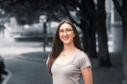 Image of woman with dark hair and glasses