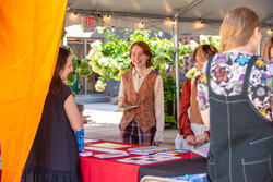 students at a welcome table during move in