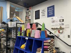 image of art supplies organized on shelves and in bins