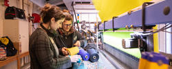 A teacher and a student use RISD's state-of-the-art Jacquard loom.