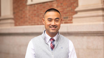 Headshot image of an Asian-American man