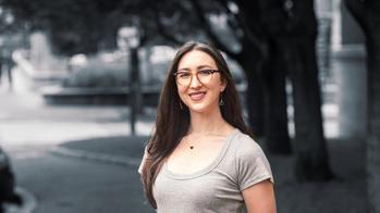 Image of woman with dark hair and glasses