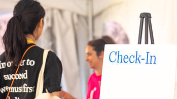 Student at a check in table
