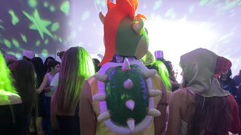 the back of a student dressed like bowser from mario brothers