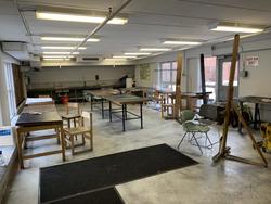 Larger work room in FYA, showing easels, chairs, sinks and drawing tables