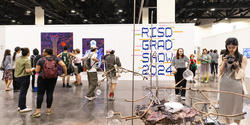 Visitors view work at Grad Show 2024