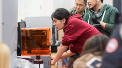A RISD student is utilizing the 3d printer resource at CoWorks.