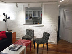 ISE programming space featuring kitchen and chairs with a coffee table