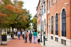 Four students walking together on canal walk