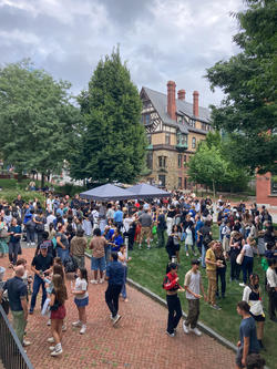 a crowd on risd beach in front of carr haus