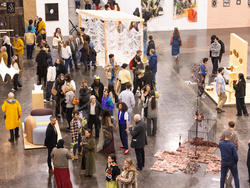 Overhead view of the crowd of visitors at opening night of the 2025 Grad show at the Rhode Island Convention Center.